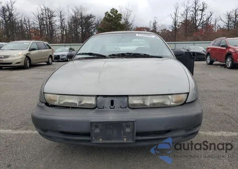 1999 Saturn Sl1 from USA, damaged, VIN 1G8ZH5284XZ187243